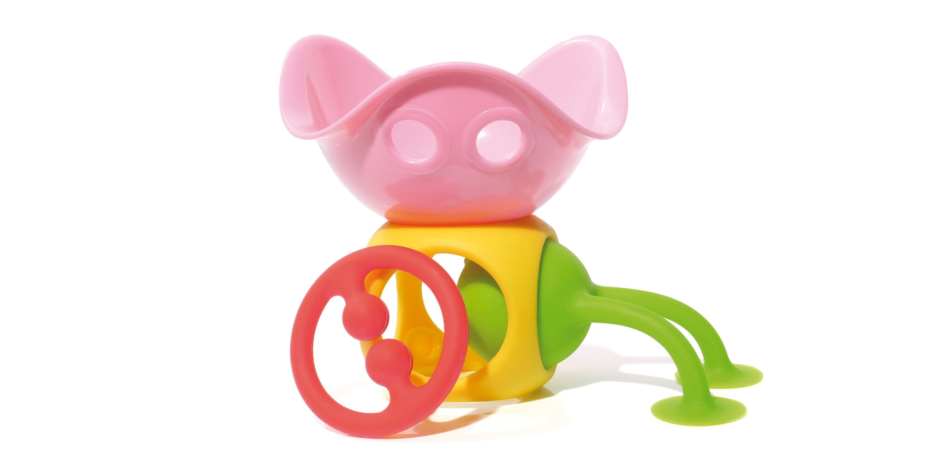Creative combination of MOLUK toys including a pink Bilibo Mini, yellow Oibo, red Nagi teether, and green Oogi Bongo assembled into a playful sculpture.