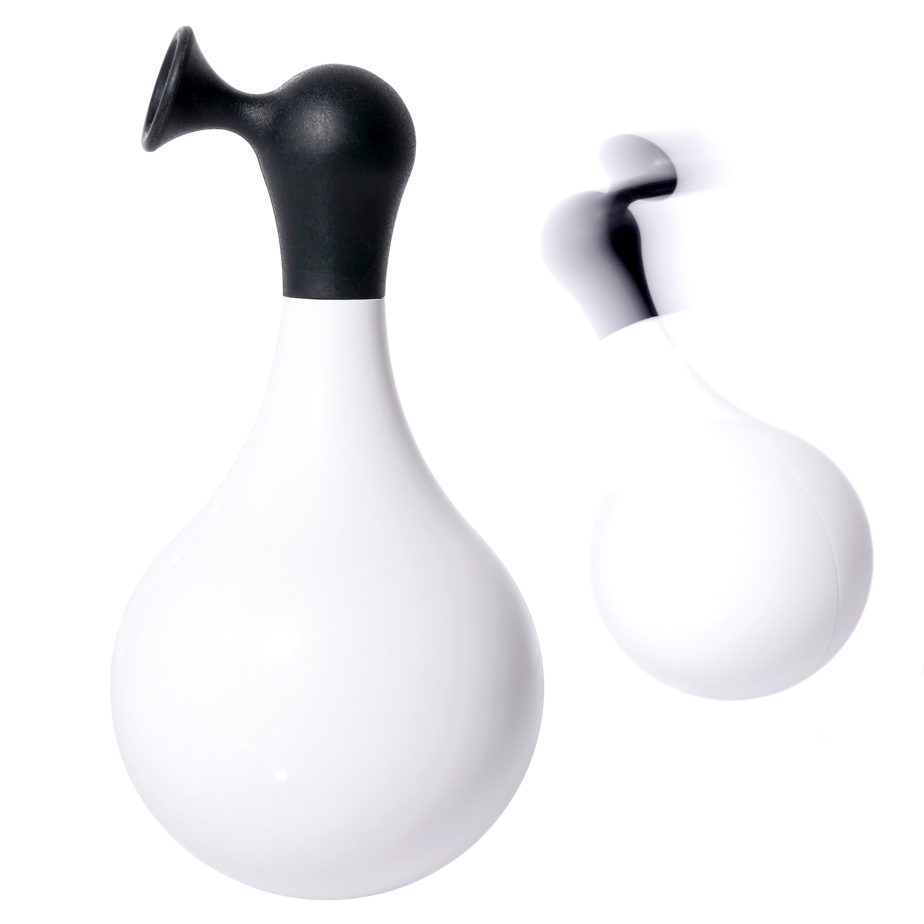 Black and white self-righting Boi wobble and bath toy by MOLUK shown still and in motion.