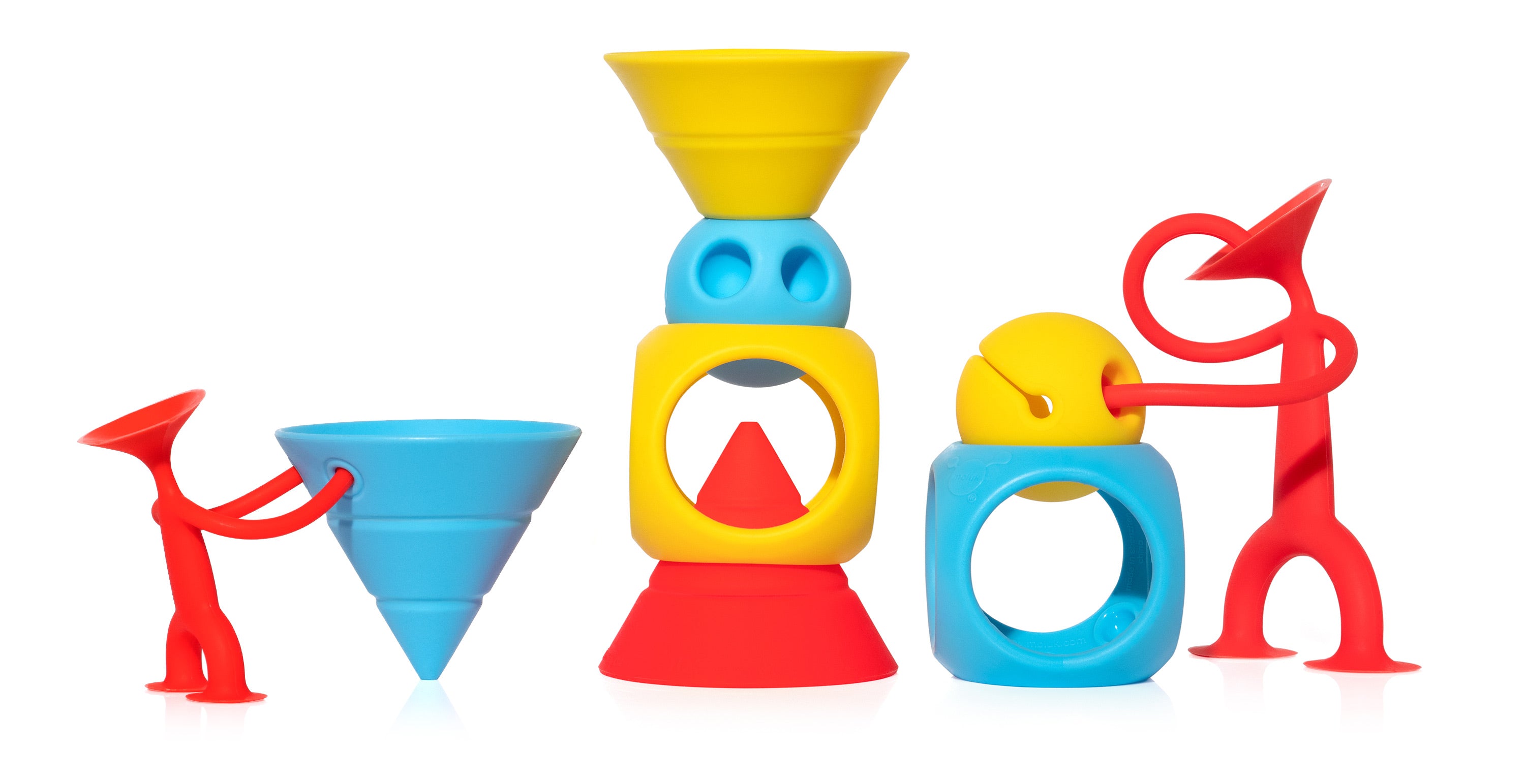 Two red Oogi suction cup figures by MOLUK play with the geometric shapes of the BUILDING GENIUS set in primary colors.