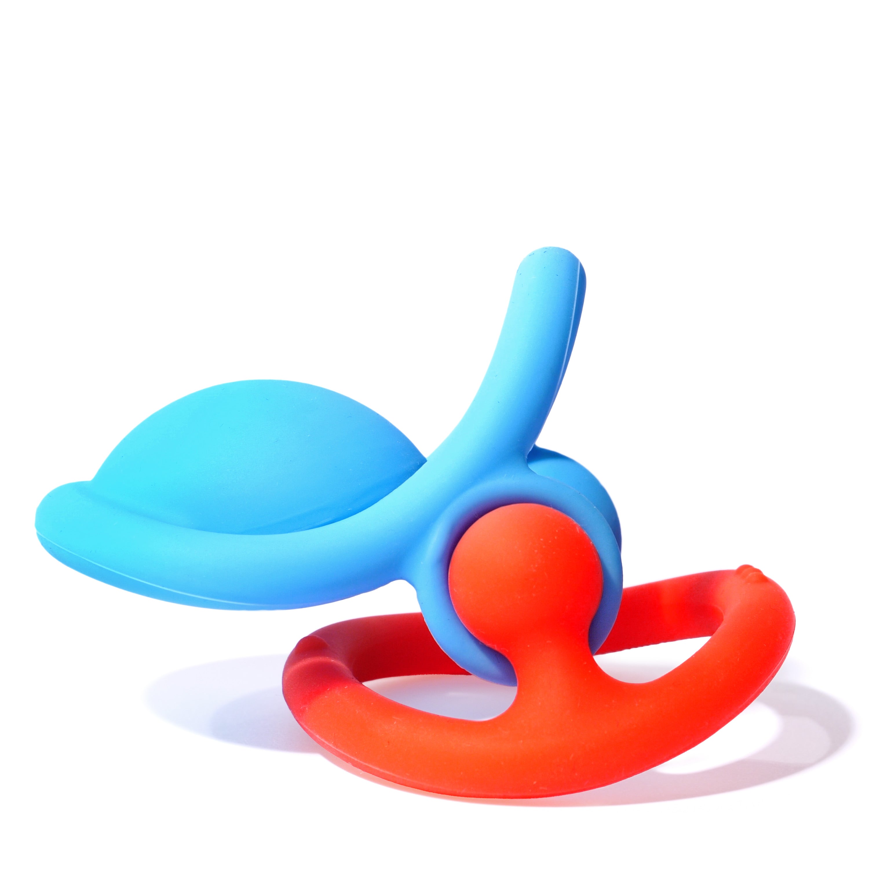 Blue and red Nigi Nagi Nogi silicone teething rings by MOLUK connected together to form imaginative new playful creations.