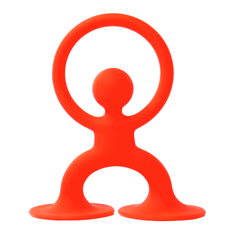 Red Noogi silicone grasping and teething toy by MOLUK, forming a circle with its arms and waving like a friendly figure.