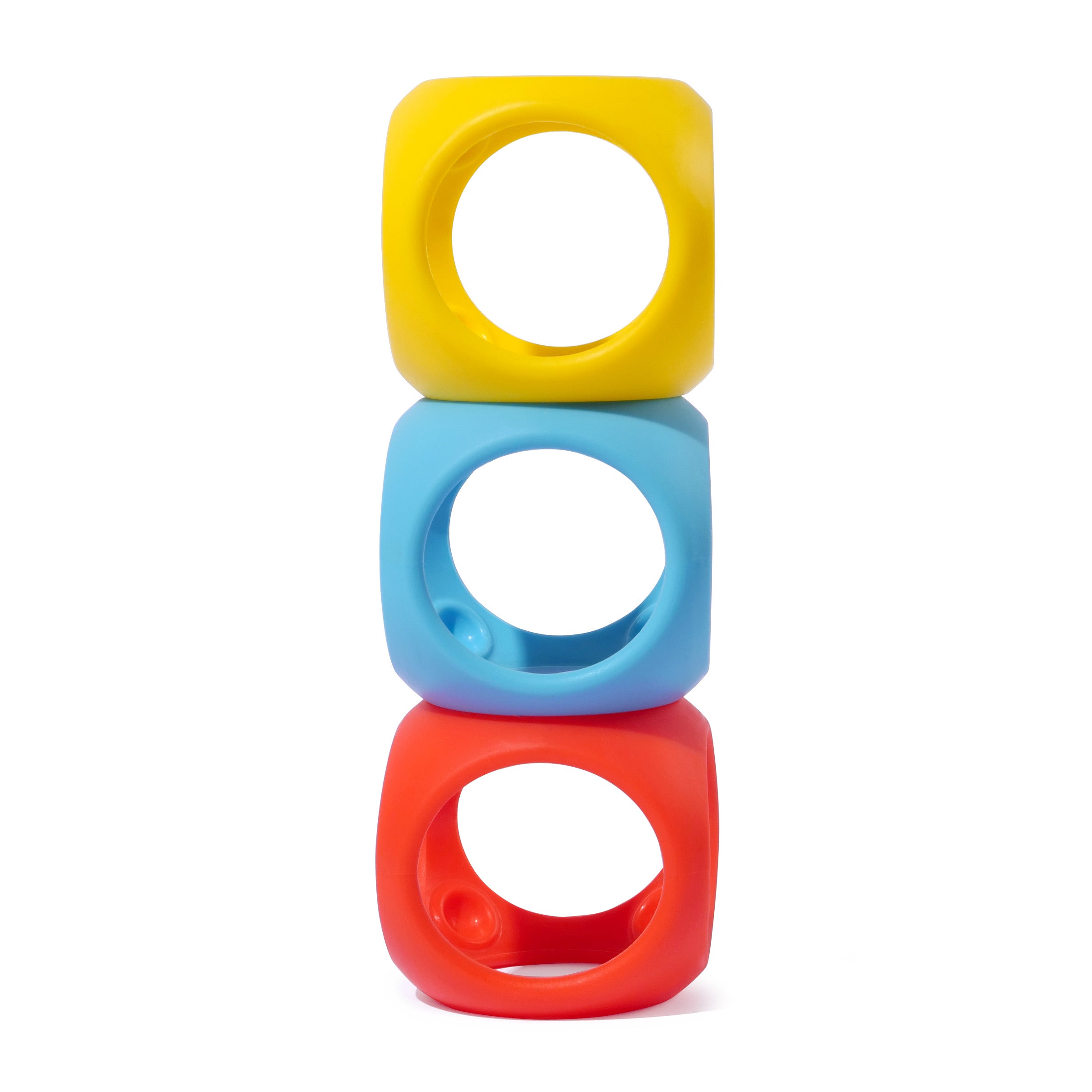 Oibo silicone building bocks by MOLUK in primary colors stacked vertically.