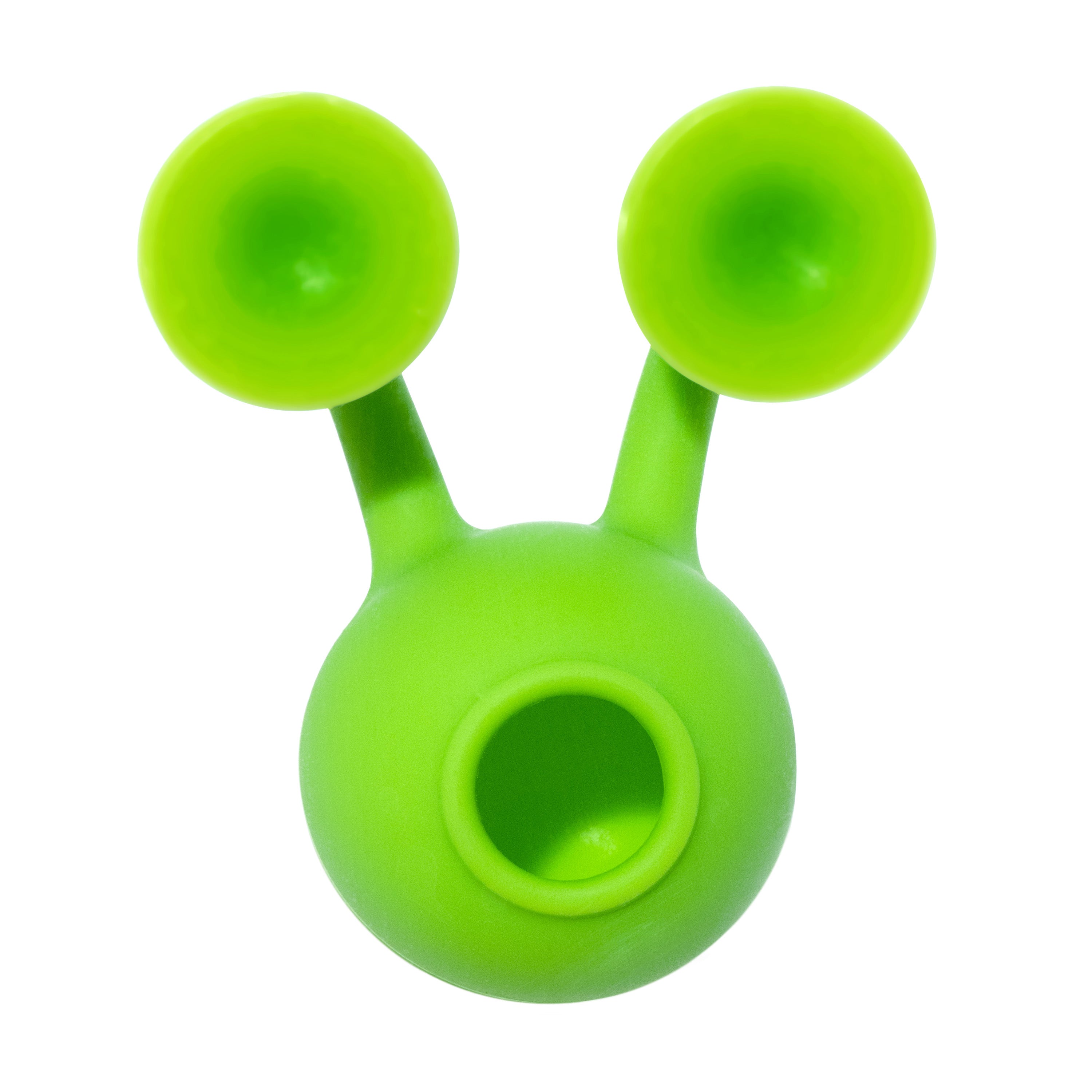 Green Oogi Bongo suction cup silicone toy by MOLUK with both suckers attached to a glass plane, forming a funny face.