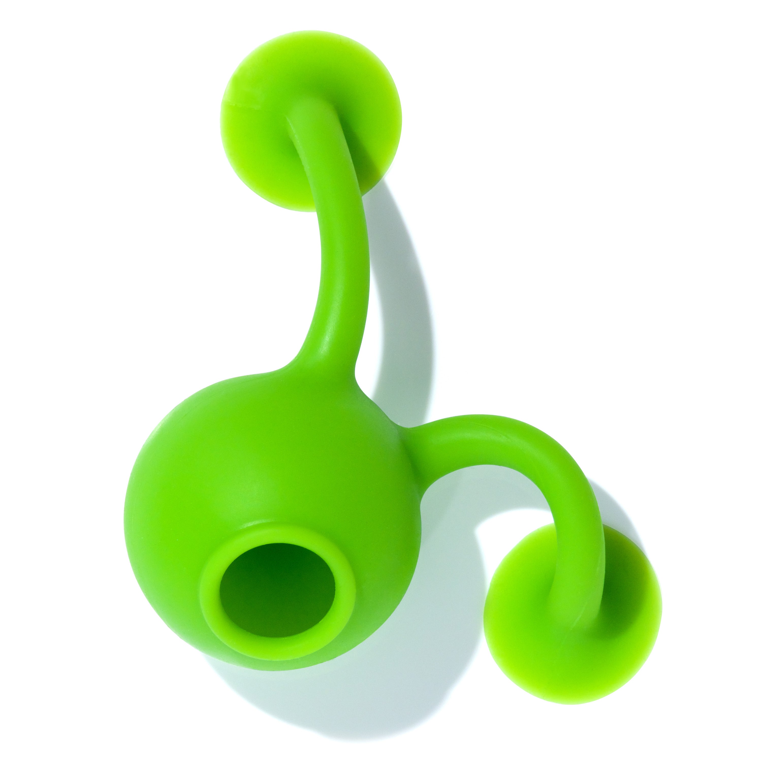 Green Oogi Bongo suction cup silicone toy by MOLUK with both suckers attached to a smooth surface in a dynamic pose.