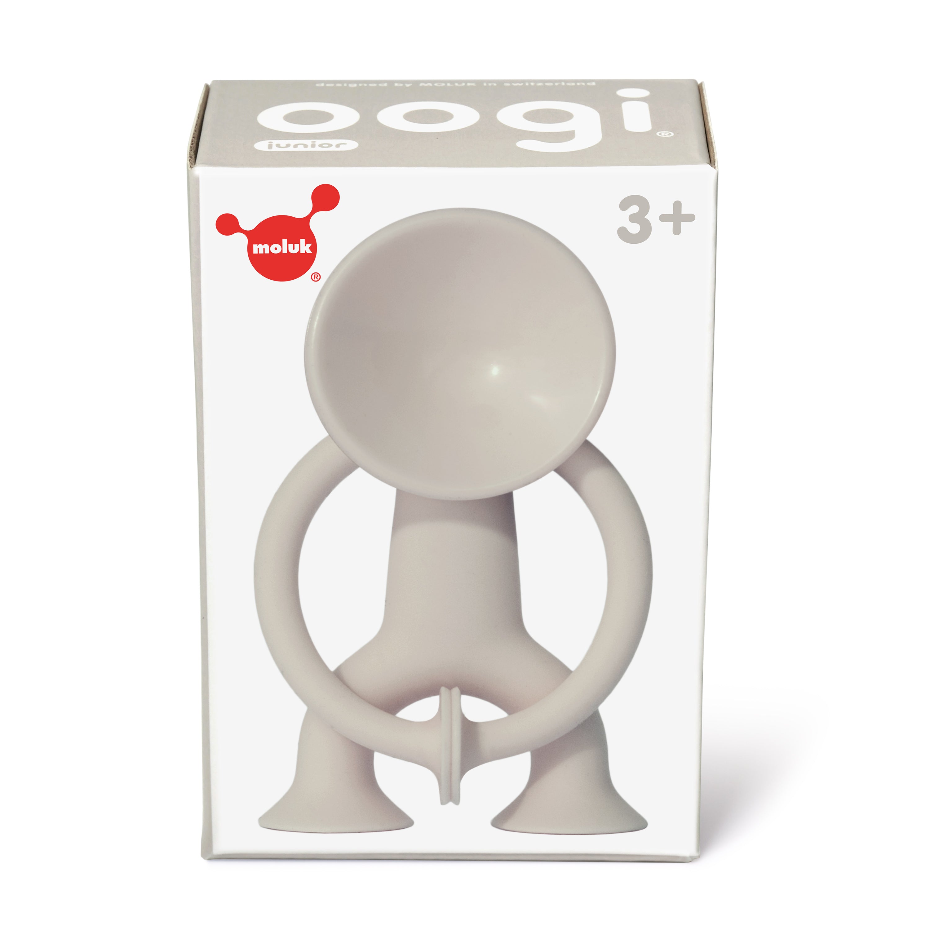 Gift box of beige Oogi Junior by MOLUK, a pocket-sized silicone suction cup figure for children ages 3 and up.