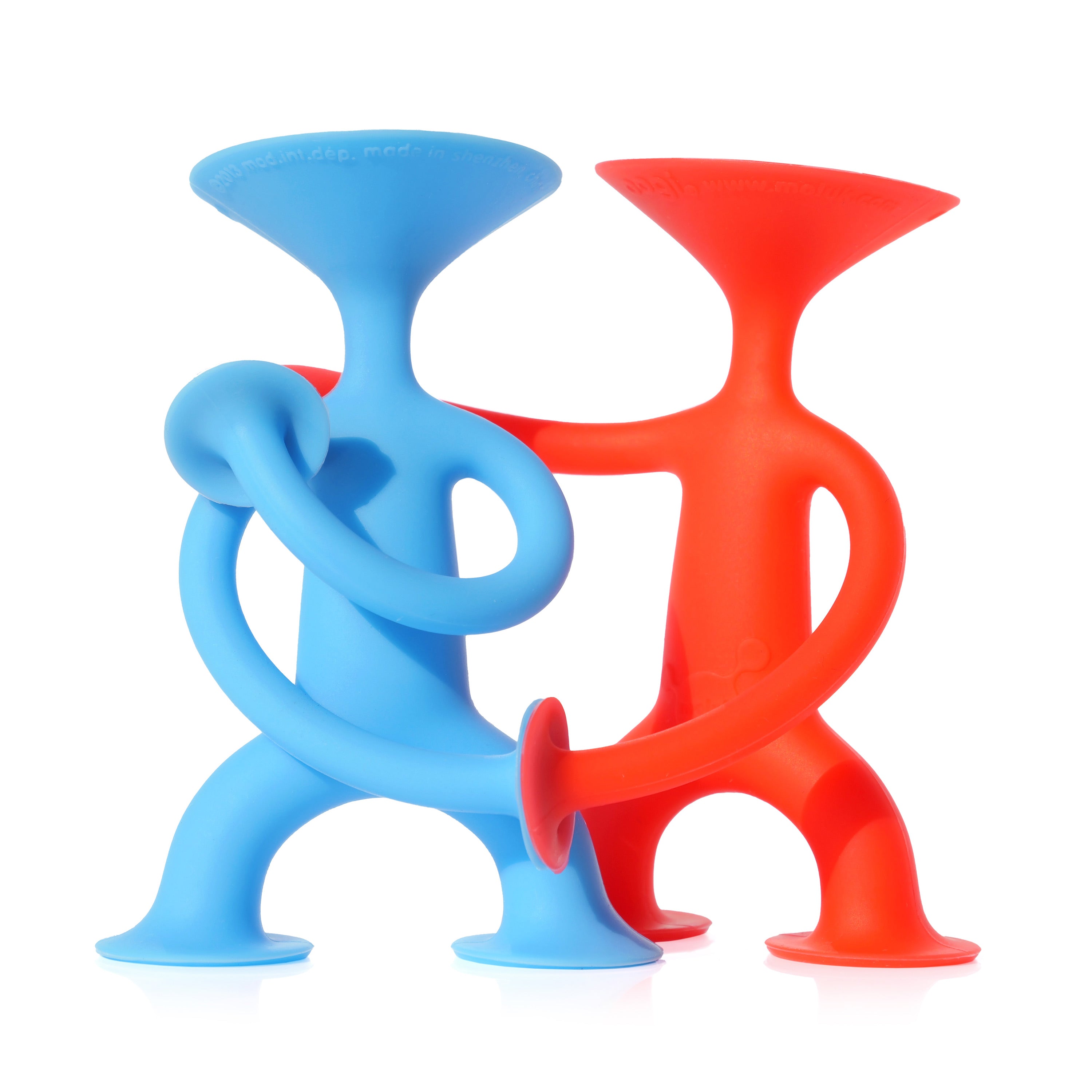 Two red and blue Oogi Junior suction cup silicone figures by MOLUK embracing and holding hands.