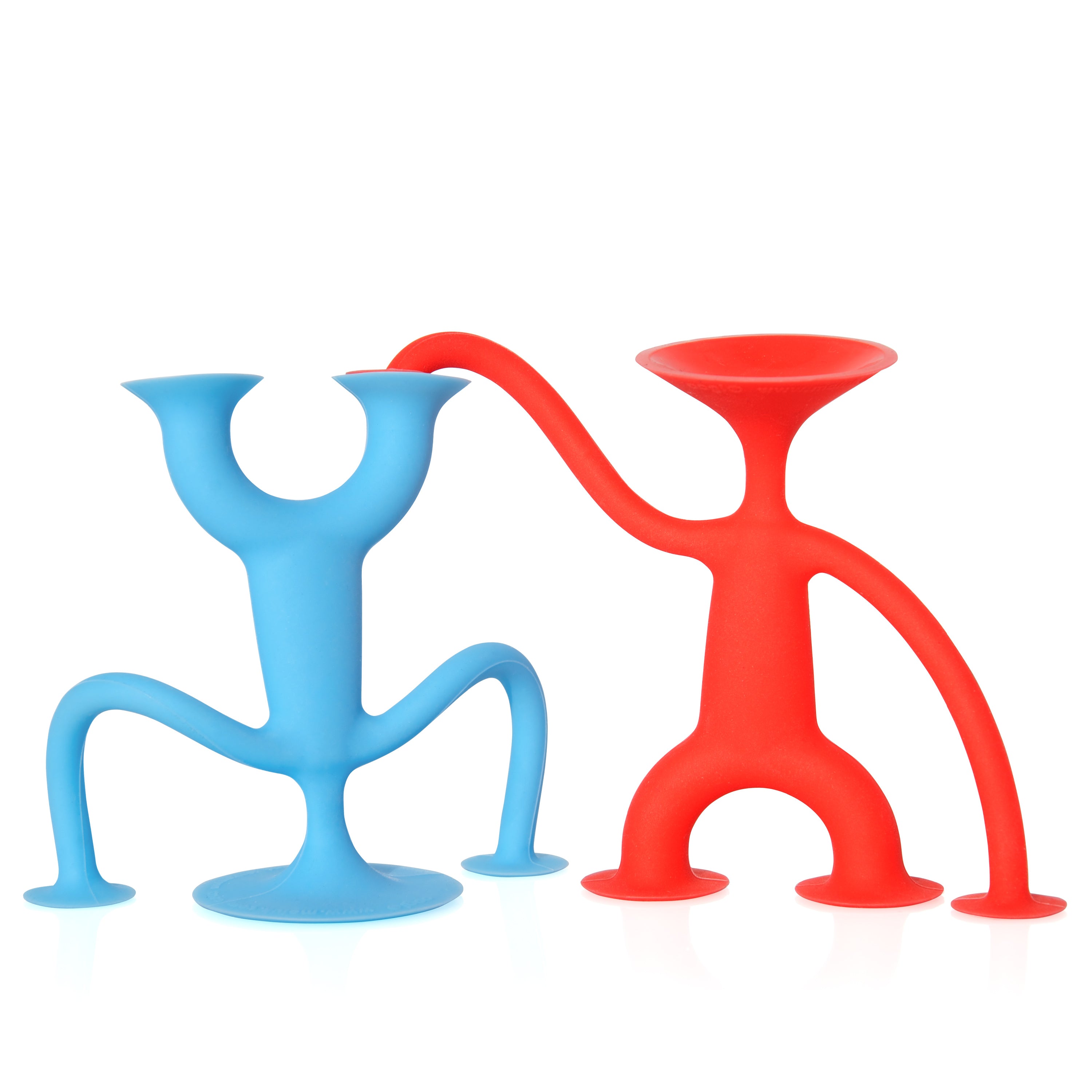 A blue Oogi Junior suction cup silicone figure doing a handstand while a red Oogi Junior is holding his foot.