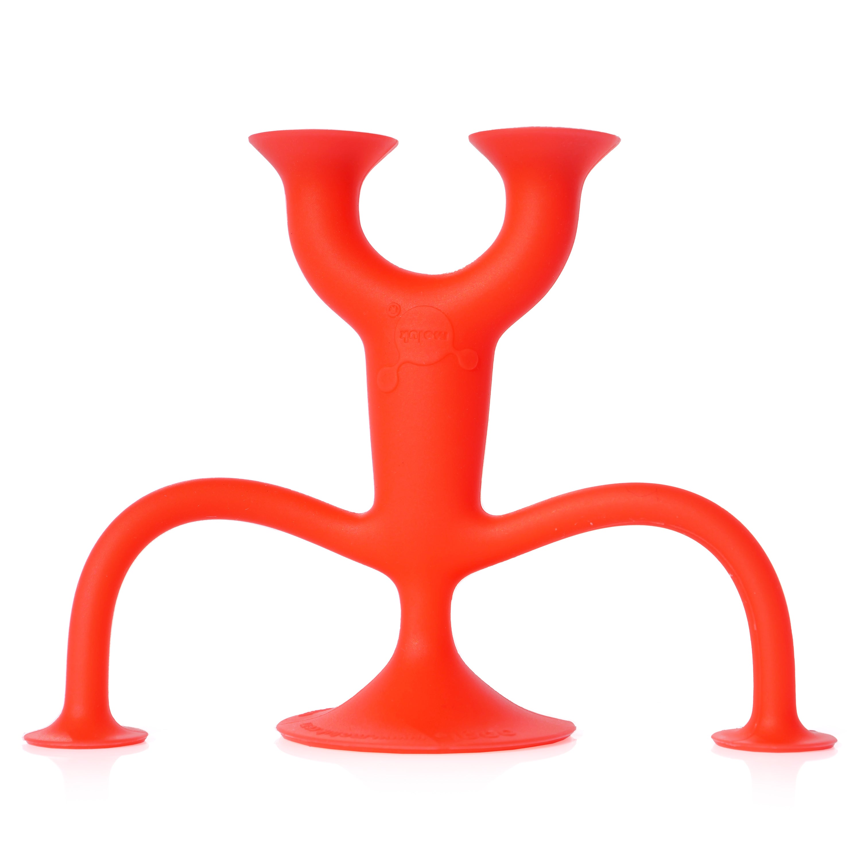 Red Oogi Junior by MOLUK, a pocket-sized silicone figure with suction cup head, hands, and feet, doing a playful handstand.