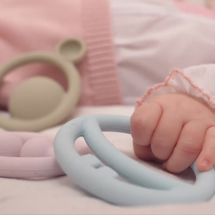 Video showing Nigi Nagi Nogi by MOLUK – soft silicone teethers and sensory toys for babies – being grasped, squeezed, and chewed during playful early development.