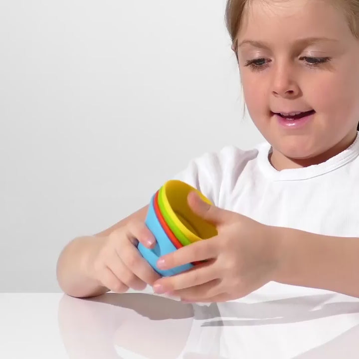 Video of children playing with Hix silicone cones by MOLUK, folding and transforming them into different geometric shapes for stacking, building and imaginative play.