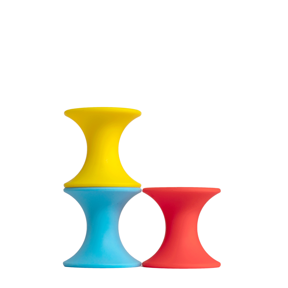 Animation of Tulu silicone building blocks by MOLUK in bright primary colors, stacking and nesting into different artistic combinations.