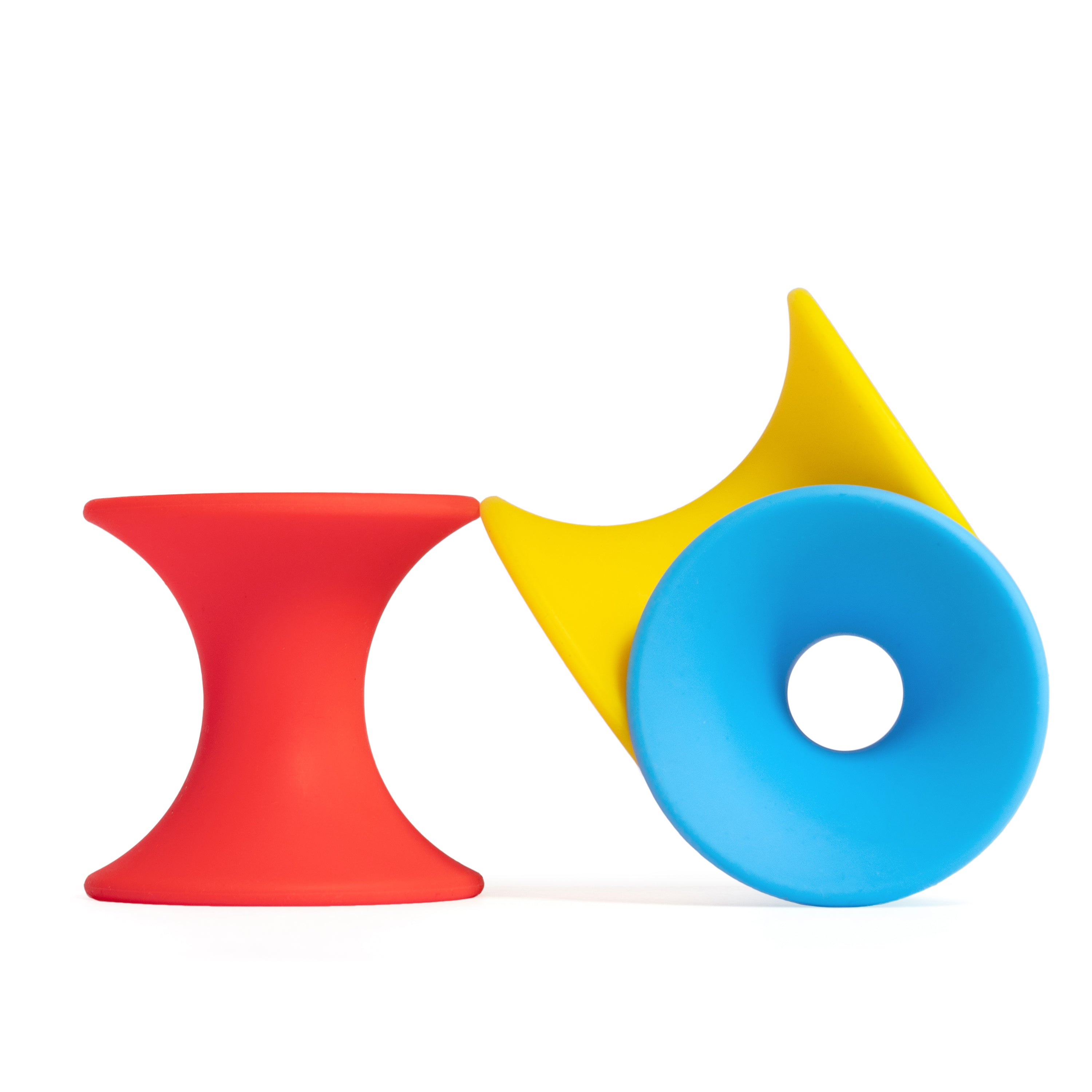 Tulu silicone building blocks by MOLUK in red, yellow, and blue, designed for stacking, nesting, rolling, and open-ended play.