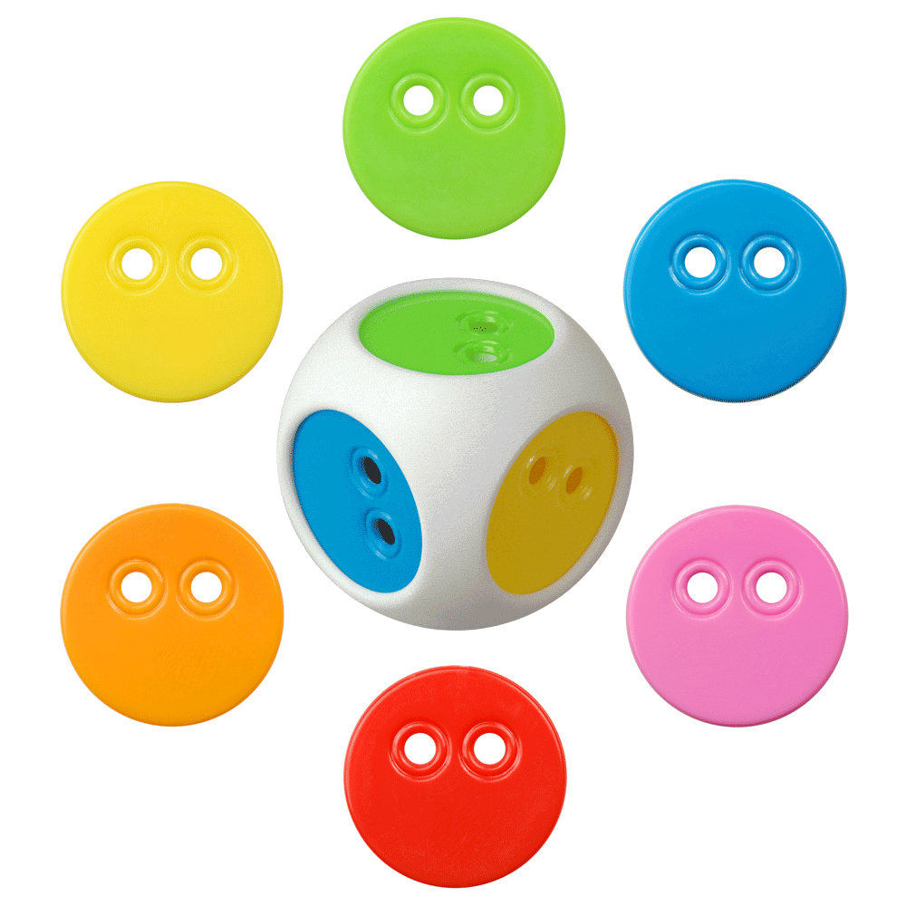 White elastic dice with changeable faces surrounded by 6 color chips, which are all part of the Bilibo Game Box set by MOLUK.