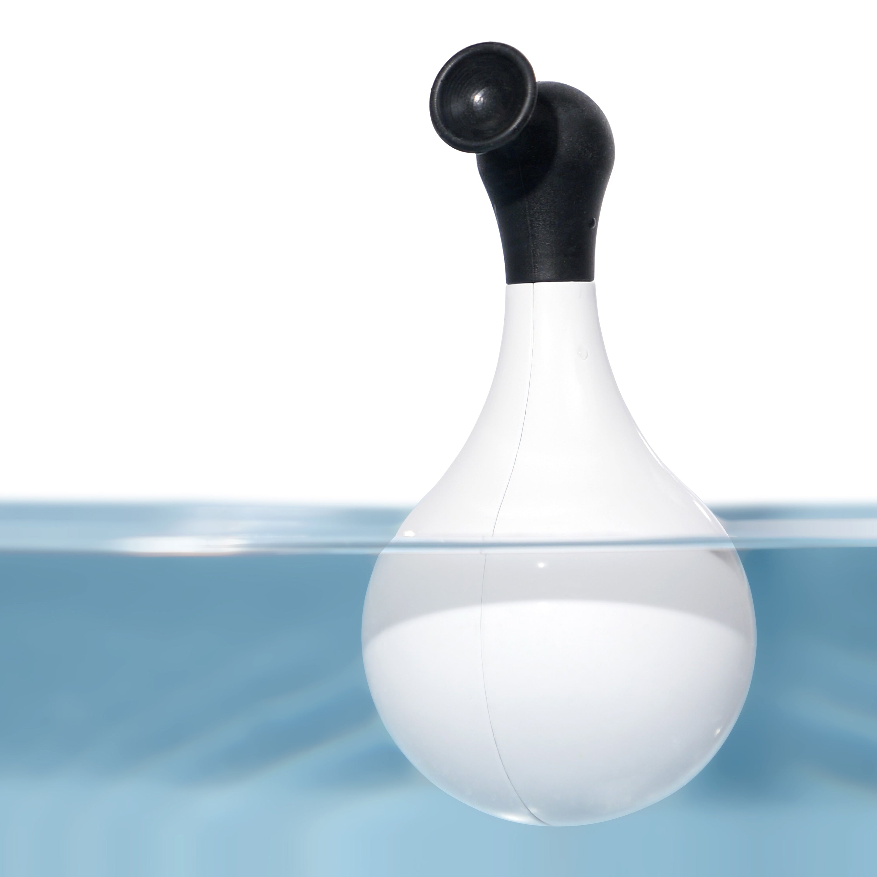 Black and white self-righting Boi wobble and bath toy by MOLUK shown floating in water.