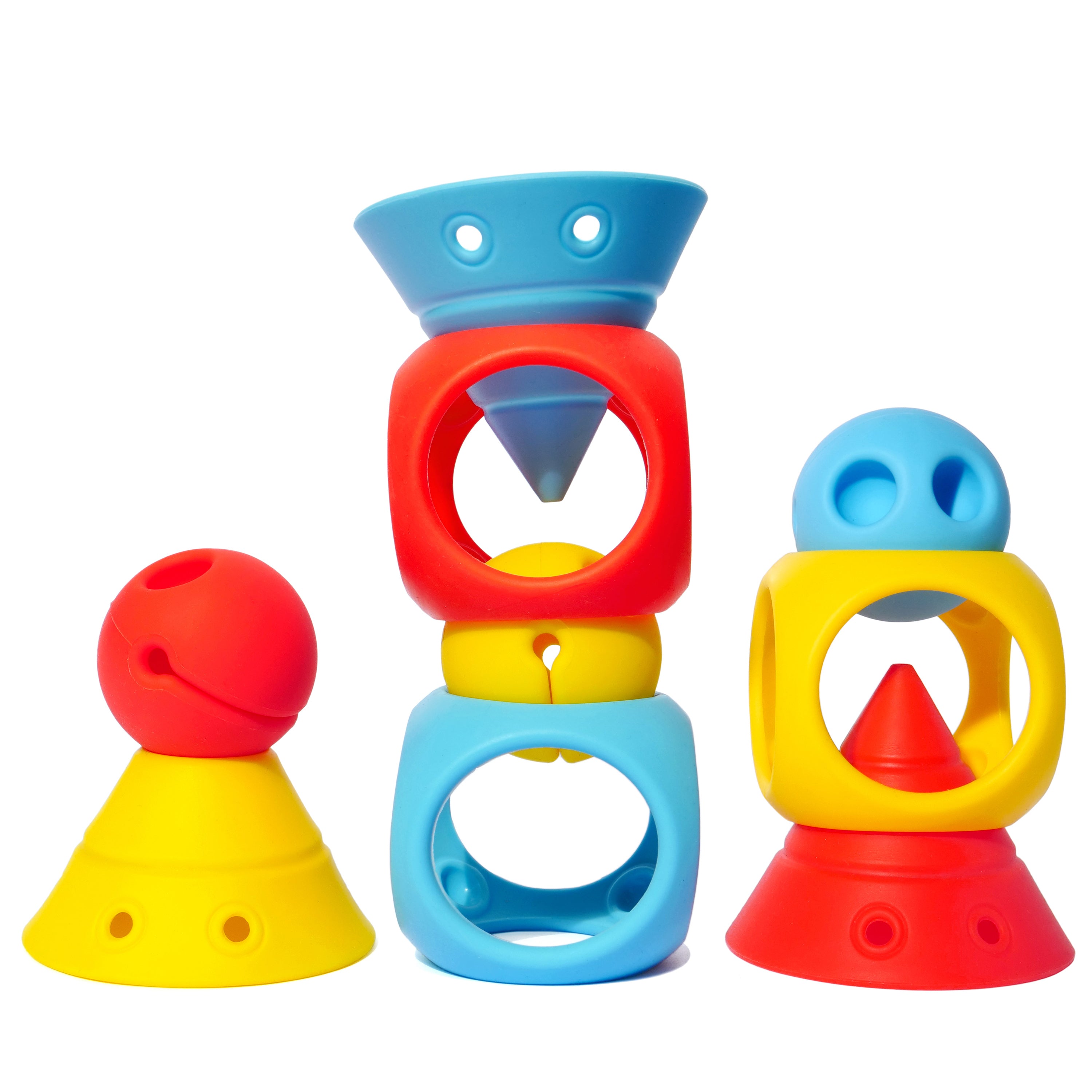 BUILDING GENIUS set by MOLUK with elastic Hix cones, Mox balls, and Oibo cubes in bright primary colors, stacked and nested into creative constructions.