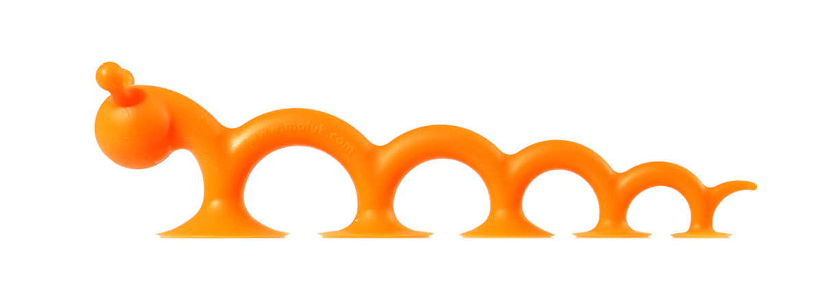 Oogi Pilla by MOLUK, a flexible orange silicone creature with suction cups, moving like a caterpillar.