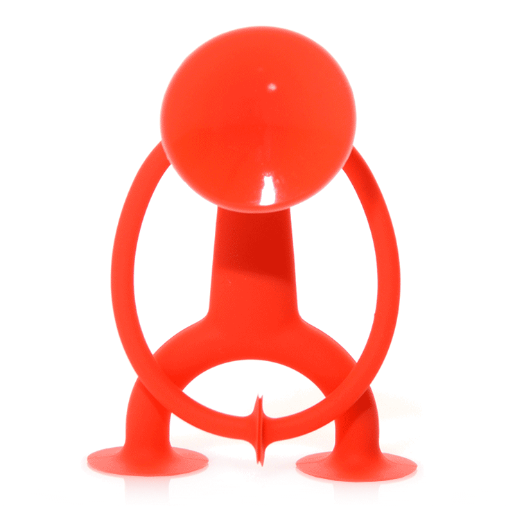Red Oogi suction cup figure toy by MOLUK glancing left and right.