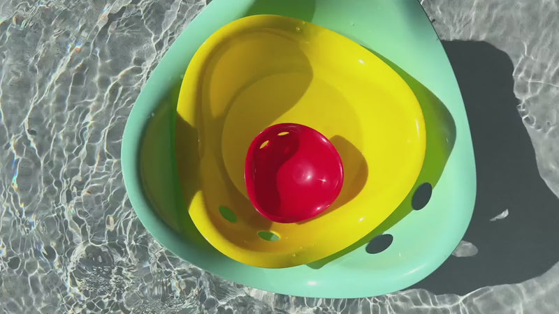 Children playing with Bilibo Midi indoors and outdoors – rocking, stacking, water play, and movement exploration.