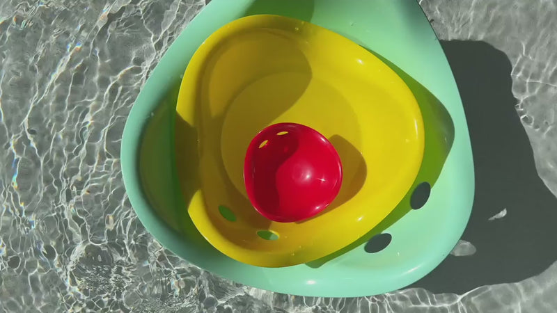 Children playing with Bilibo Midi indoors and outdoors – rocking, stacking, water play, and movement exploration