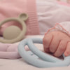 Video of babies exploring MOLUK’s Nigi Nagi Nogi silicone teething rings, grasping, chewing, and fidgeting during sensory play.
