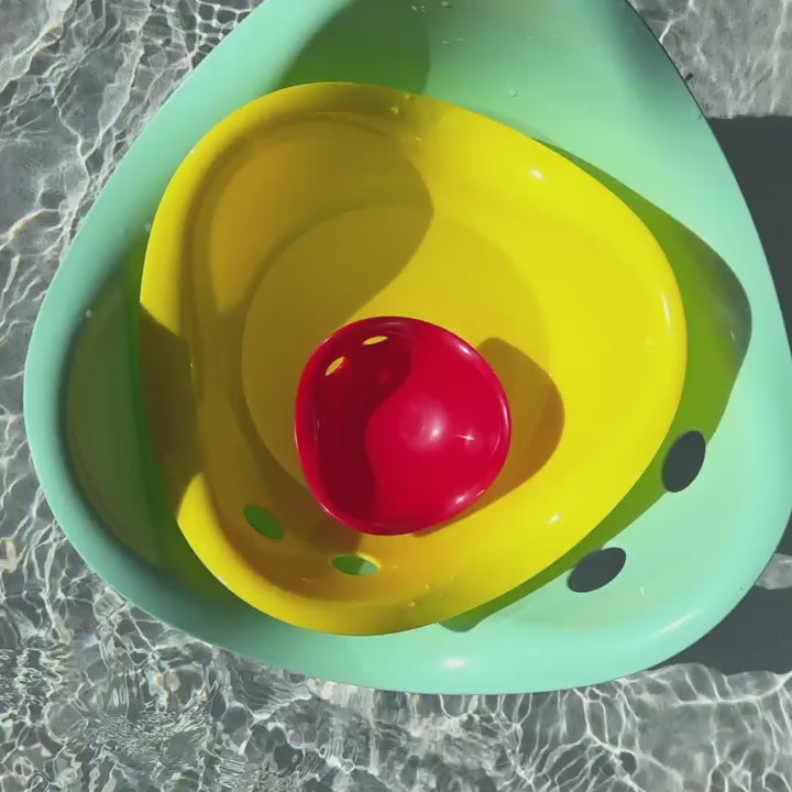 Children playing with Bilibo Midi indoors and outdoors – rocking, stacking, water play, and movement exploration.