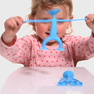 Video featuring the Oogi Family by MOLUK, showing expressive silicone suction cup figures stretching, sticking, and interacting in creative play.