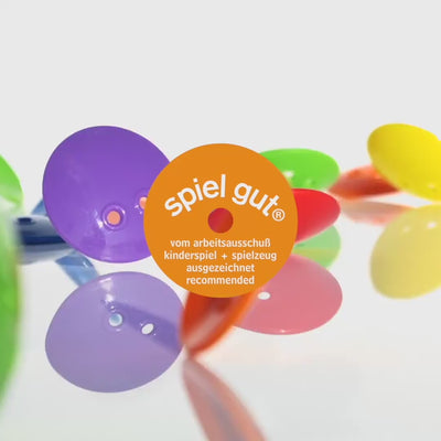 Video showing children playing with Bilibo Dots – sorting, stacking, threading, mixing, and imaginative open-ended play. Winner of the spielgut® award.