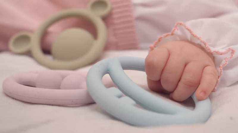 Video showing Nigi Nagi Nogi by MOLUK – soft silicone teethers and sensory toys for babies – being grasped, squeezed, and chewed during playful early development.