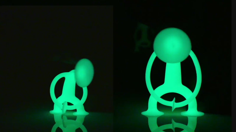 Video of Oogi GLOW figures by MOLUK playing in the dark, their glowing silicone bodies stretching, sticking, and connecting.
